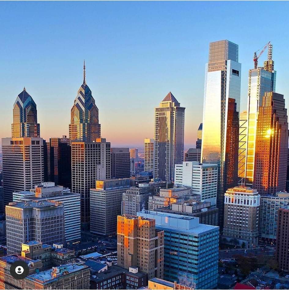 A view of the city skyline at sunset.